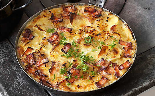 Überbackene Erdäpfel mit Schweinebauch - (c) Foto: Eisenhut & Mayer Überbackene Erdäpfel
