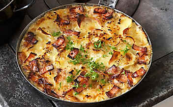 Überbackene Erdäpfel mit Schweinebauch - (c) Foto: Eisenhut & Mayer Überbackene Erdäpfel